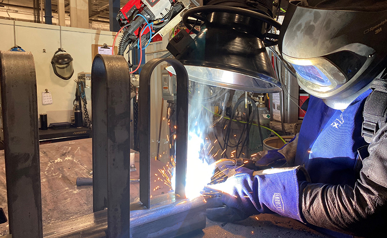Welder at EJ manufacturing site in Shroeppel, NY