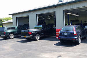 three cars entering the bays at Murphy's Automotive